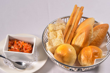 Bread set served with tomato, mozzarella,
