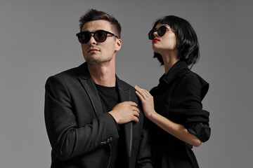 man and woman in sunglasses