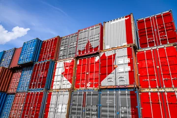Fotobehang The national flag of Canada on a large number of metal containers for storing goods stacked in rows on top of each other. Conception of storage of goods by importers, exporters © Виталий Сова