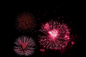 Red fireworks on black background for winter and new year festivals