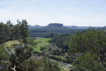 Fototapeta na wymiar View over Kurort Rathen and different mountains in Saxon Switzerland