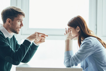 man and woman in office