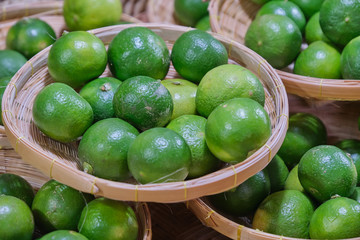 Lemon in basket bamboo. wooden plate