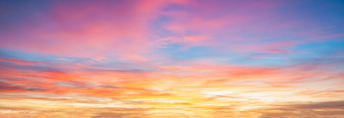Colorful cloudy sky at sunset background © Vadim