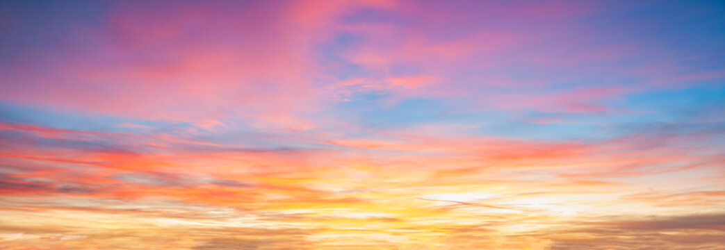 Colorful cloudy sky at sunset background