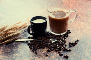 Hot coffee with milk on the metal table top