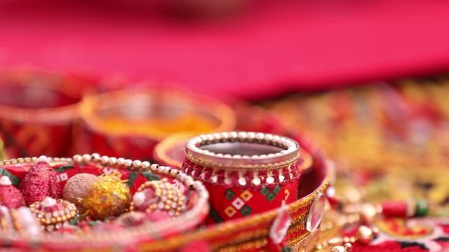 Traditional indian wedding ceremony in Hinduism : Holding puja thali and oil lamp in hand