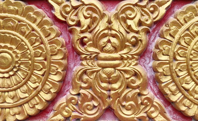 Traditional Thai style stucco on the wall of church in temple, Thailand.