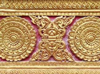 Traditional Thai style stucco on the wall of church in temple, Thailand.