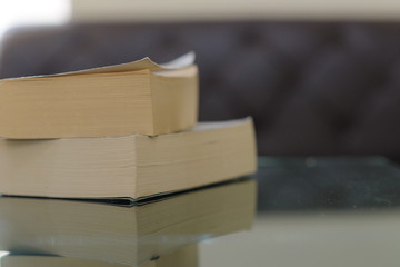 Stack of books on wooden table with copy space. Education background. Back to school concept