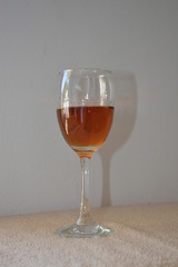Brandy in wine glass and white background