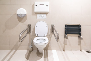 Public restroom for disabled people with special equipment