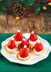 Santa Claus pancakes with whipped cream and strawberries, Christmas food idea
