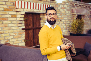 Handsome young man with a phone in his hand