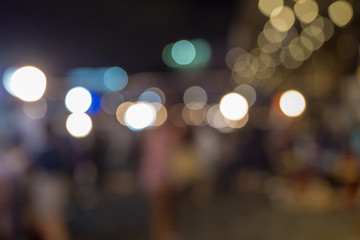 Bokeh light in the evening market city at Bangkok , Thailand.Abstract bokeh light of the city in...