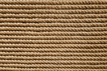 Beige brown grungy round twisted strong rope or thread weave from nautical industry material craft...