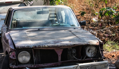 Fototapeta premium abandoned old car on the side of a road