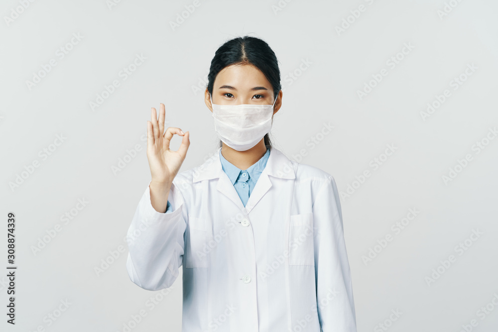 Wall mural doctor with thumbs up gesture isolated on white