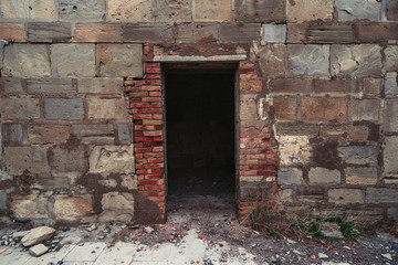 Old door to an abandoned ruined house