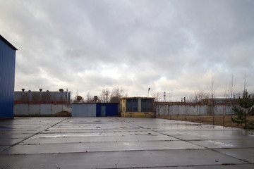 Industrial zone on the outskirts of a big city in autumn