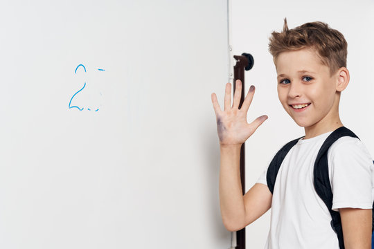 Boy Writing On White Board