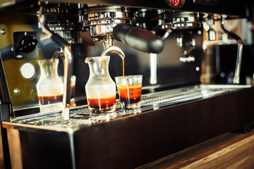 The machine coffee and water coffee in the cup of coffee.