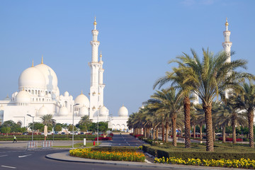 Fototapeta na wymiar Famous White Grand Sheikh Zayed Mosque with high golden minarets 2