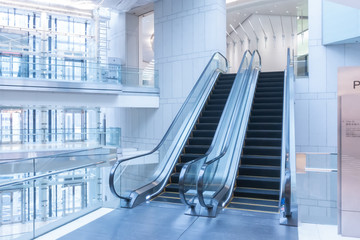 Background image with two escalator in modern building