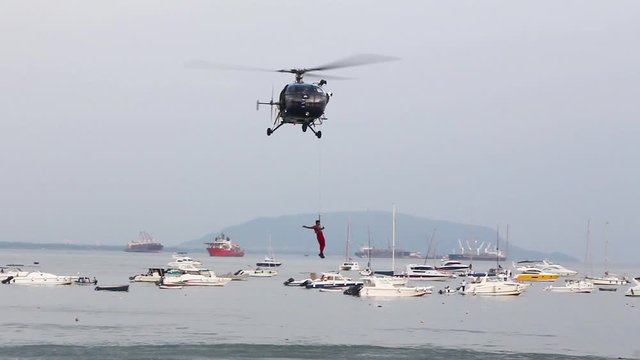 Indian Navy Chetak Helicopter demonstrating rescue operation during Indian Navy Day 2019 aerial display event rehearsal at Gateway of India, Mumbai. 4832.