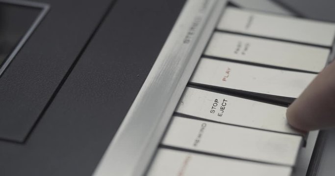 Stopping PLAY and EJECT button on retro audio cassette tape player recorder