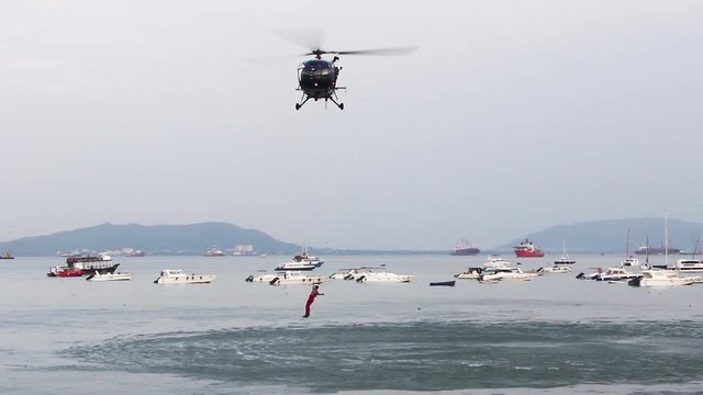 Indian Navy Chetak Helicopter demonstrating rescue operation during Indian Navy Day 2019 aerial display event rehearsal at Gateway of India, Mumbai. 4834.