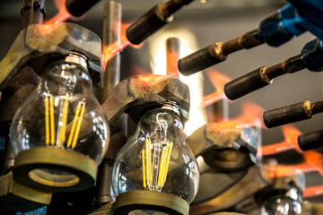 Fototapeta na wymiar Lamp production at the factory, manufacturing process.