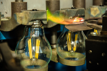 Lamp production at the factory, manufacturing process.