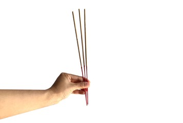 A hand holding 3 of incense.