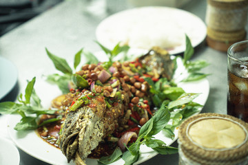 Herbal snakehead fish salad served with sticky rice