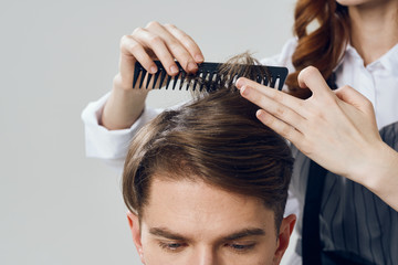 Fototapeta premium hairdresser with scissors and comb