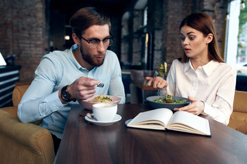 young couple having dinner in restaurant