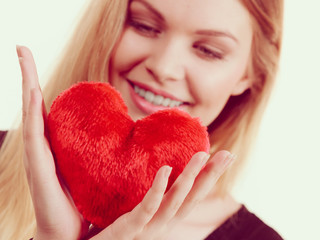 Woman holding red heart