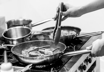 Chef preparing food in the kitchen, chef cooking, Chef decorating dish