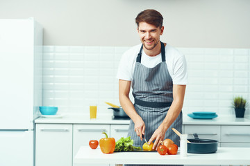 man cooking in kitchen