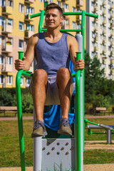 Man doing sit ups in outdoor gym