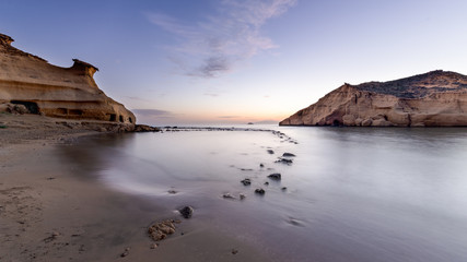 Fototapeta na wymiar Playa de Los Cocedores, también conocida como playa cerrada, situada en el límite entre Murcia y Almería