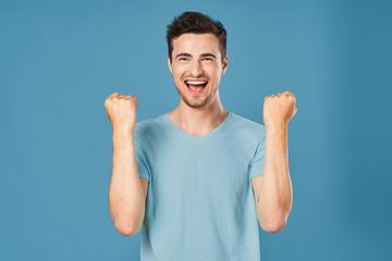 happy man with arms raised in the air
