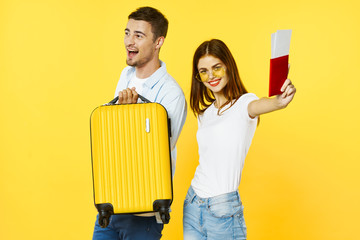 couple painting wall with paint roller