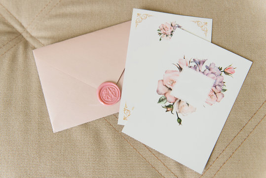Stylish pink wedding invitation on light background with beautiful details, copyspace