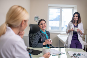 Three female doctors feeling good at work place