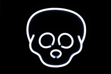 White skull neon sign on isolated black background. Neon concept. Modern style. Neon sign.