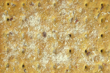 Natural healthy food. Cereal biscuits with flax seeds with salt. Background texture macro.
