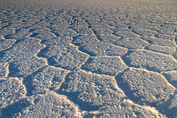 Salt pattern at sunset in the salar of Uyuni . Bolivia