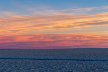 Colorful sunset in the salar of Uyuni
